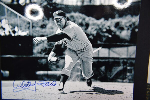 Black and white photo of a baseball pitcher.