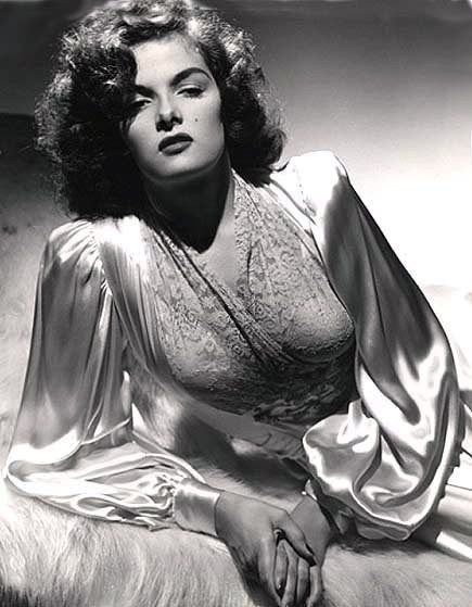 Black and white photo of a woman in a satin robe.