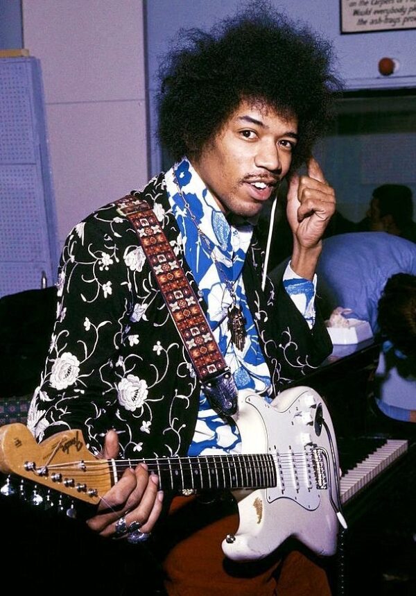 Jimi Hendrix playing electric guitar.