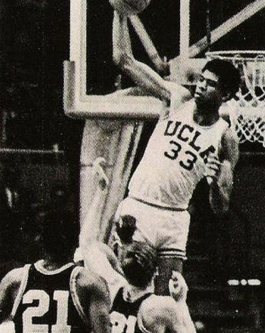 UCLA basketball player dunking the ball.